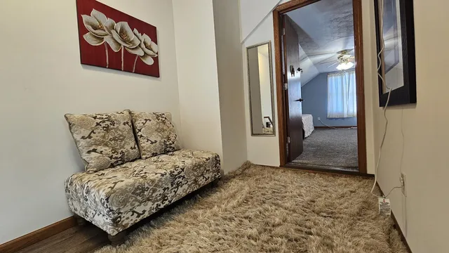 a living room with furniture and a gate