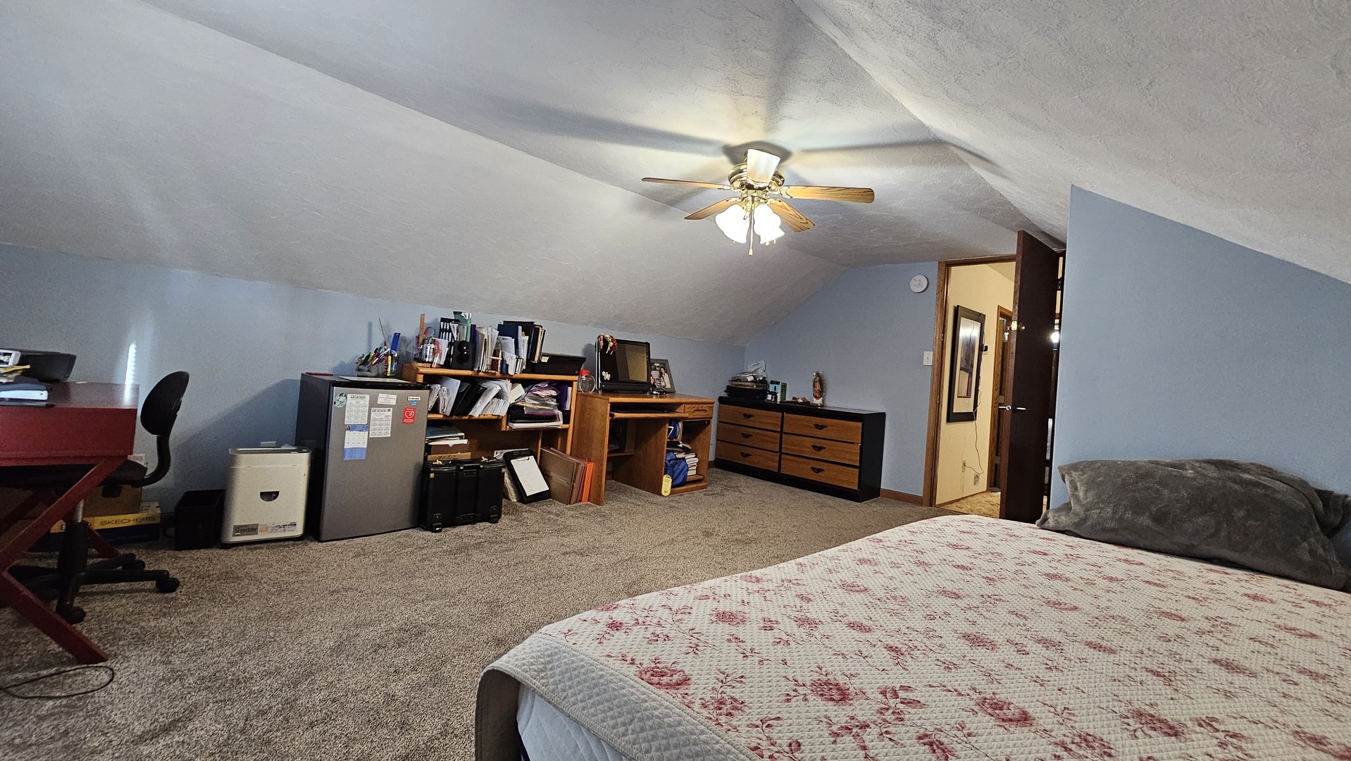 703 Lincoln Street Harvard, IL 60033 - Photo 15 of 27 a bedroom with a bed and a chandelier