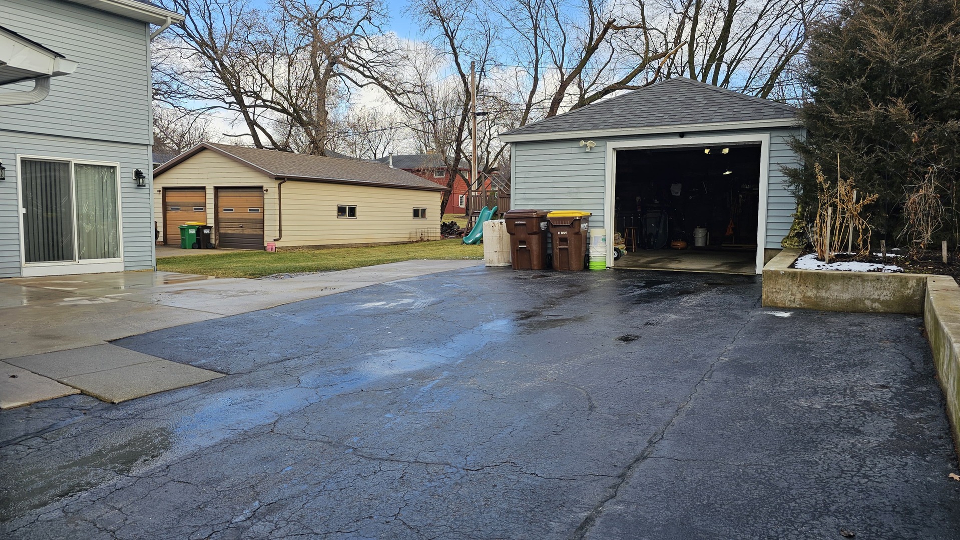 703 Lincoln Street Harvard, IL 60033 - Photo 27 of 27 a view of a house with a yard and large tree
