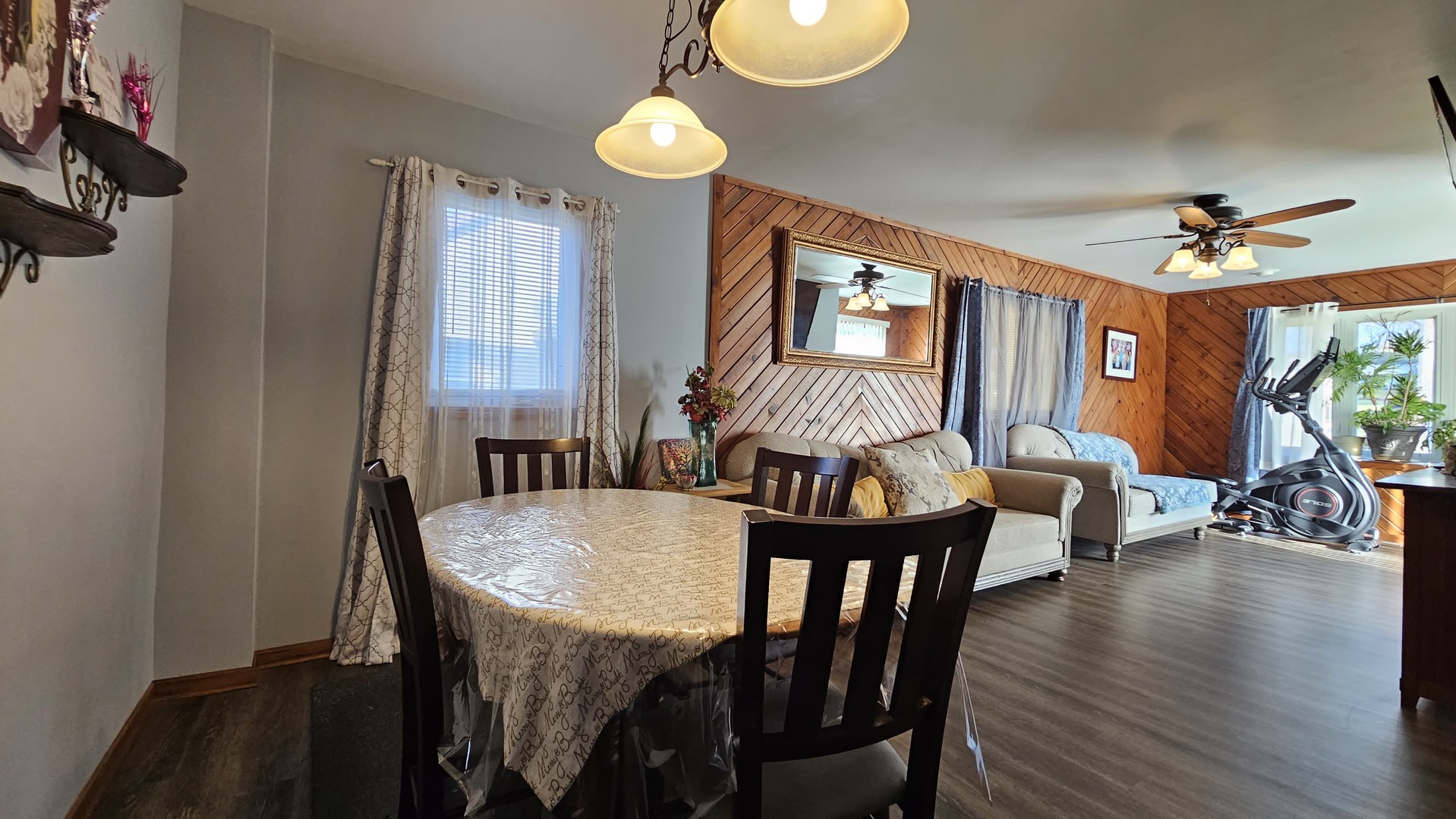 703 Lincoln Street Harvard, IL 60033 - Photo 9 of 27 a view of a a dining room with furniture window and wooden floor