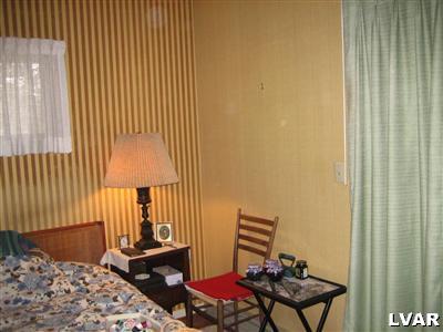 640 Bok Road Nazareth, PA 18064 - Photo 22 of 28 a bedroom with a bed and wooden floor