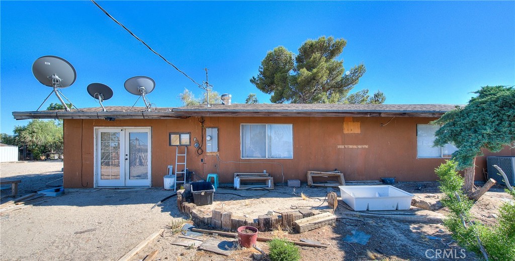 45757 Paddington Road Lucerne Valley, CA 92356 - Photo 1 of 18 a view of a two chairs in the patio