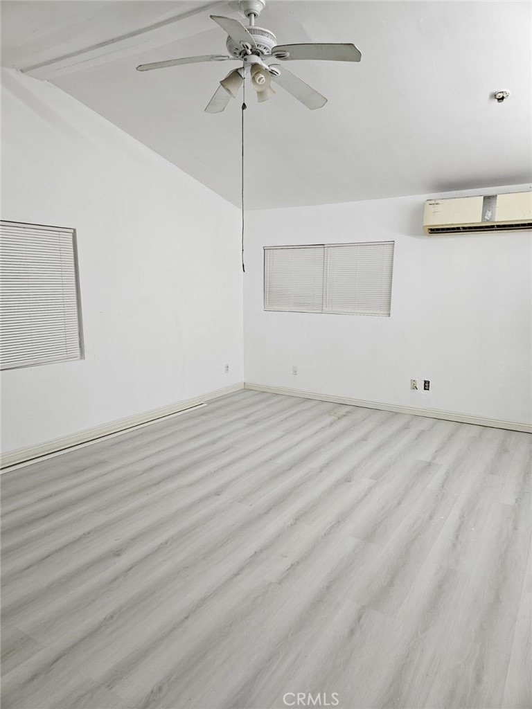 45757 Paddington Road Lucerne Valley, CA 92356 - Photo 7 of 18 a view of room with window and ceiling fan