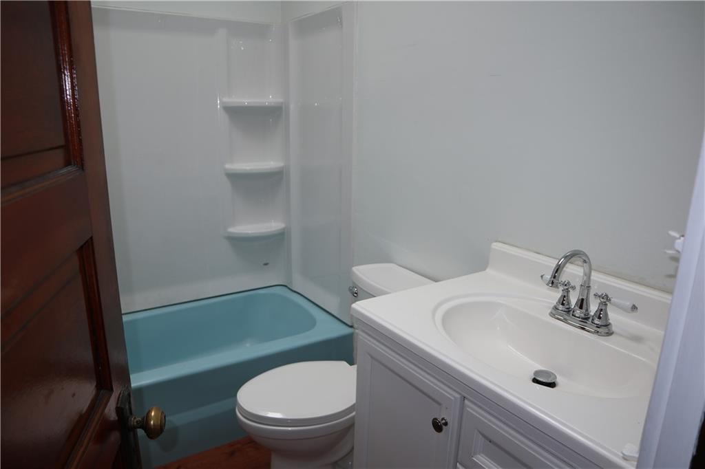 426 Broad Avenue, Unit 2 Belle Vernon, PA 15012 - Photo 13 of 13 a bathroom with a sink toilet and a mirror