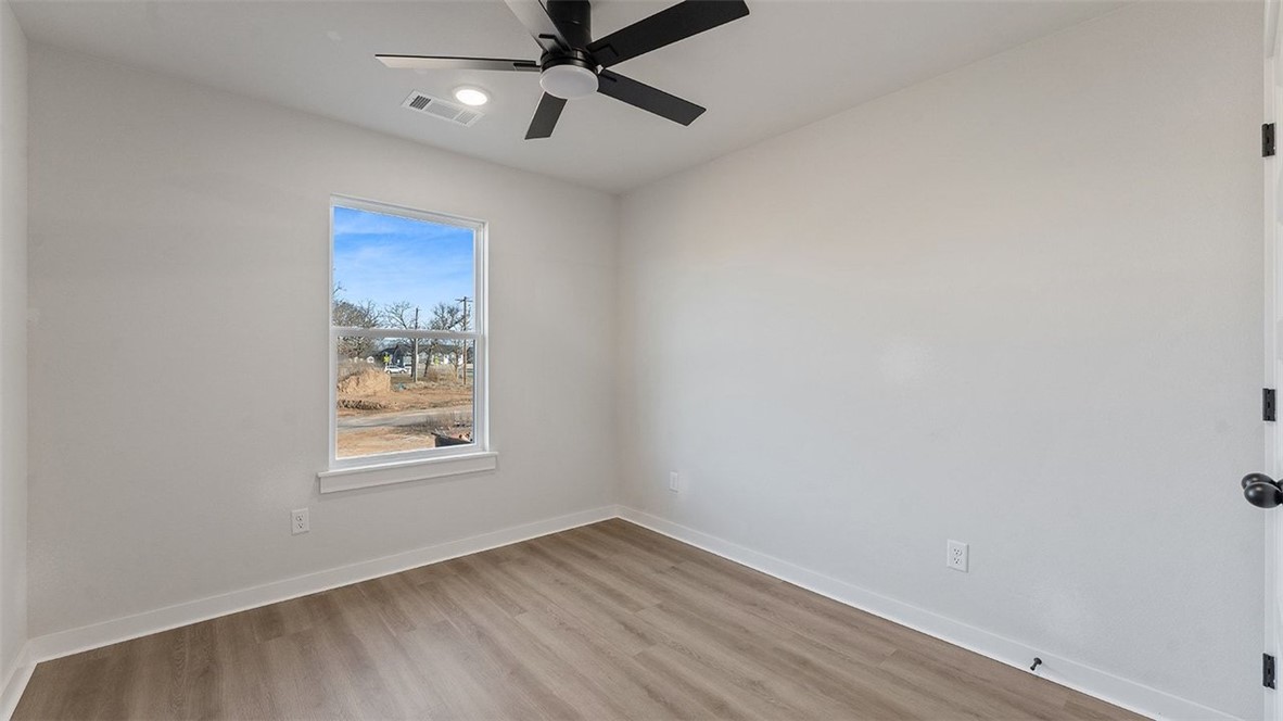 1715 Cuppett Circle Pea Ridge, AR 72751 - Photo 8 of 15 Neutral wall tones with wood-finish flooring