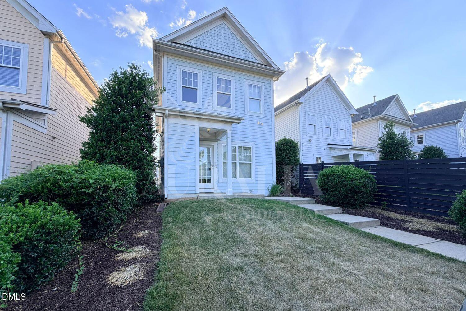 7754 ACC Boulevard Raleigh, NC 27617 - Photo 38 of 41 a front view of a house with a yard
