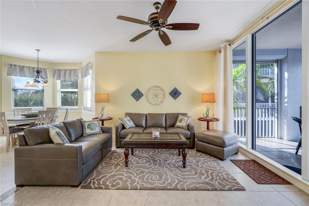 460 Launch Circle, Unit 301 Naples, FL 34108 - Photo 1 of 28 a living room with furniture and a rug