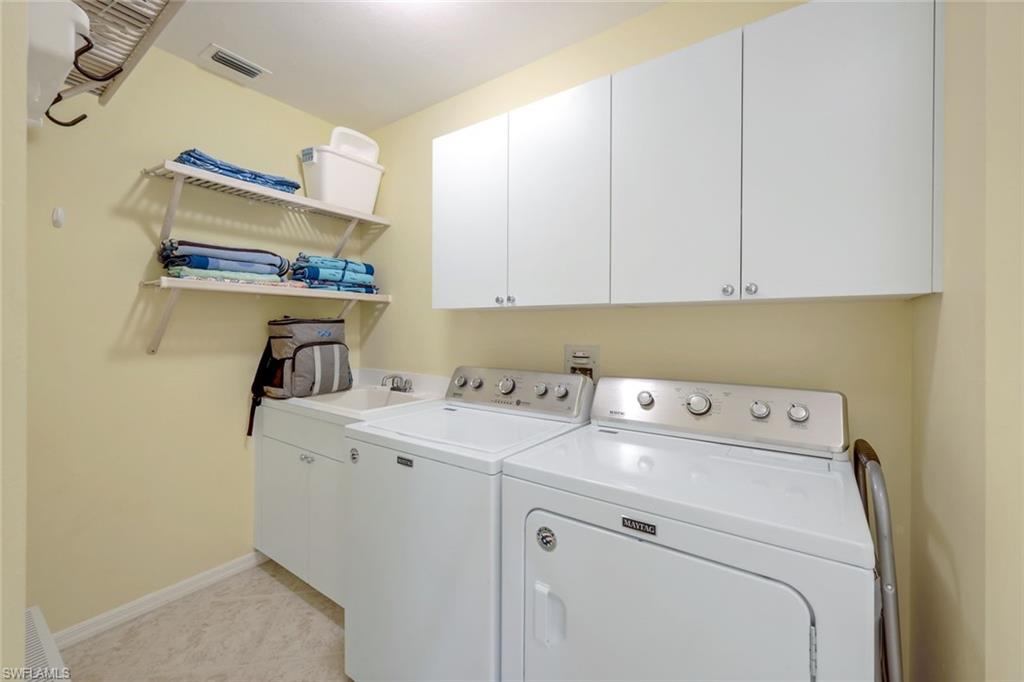460 Launch Circle, Unit 301 Naples, FL 34108 - Photo 12 of 28 a utility room with dryer and washer