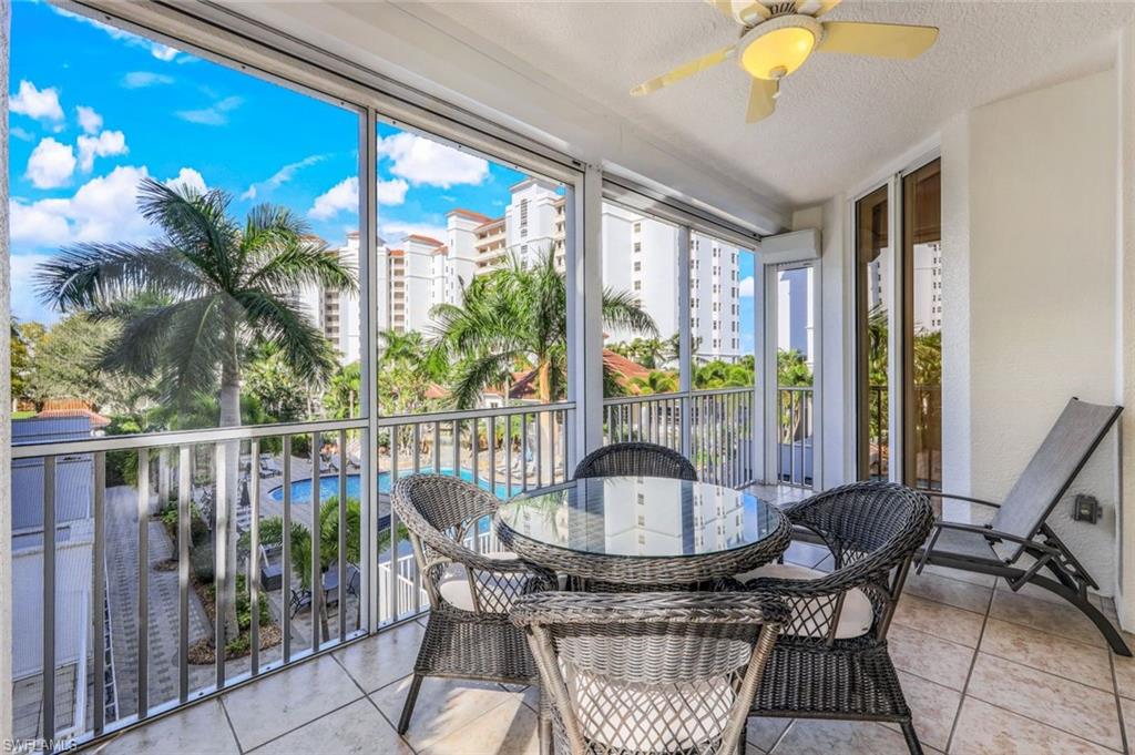 460 Launch Circle, Unit 301 Naples, FL 34108 - Photo 13 of 28 a view of a dining room with furniture window and outside view