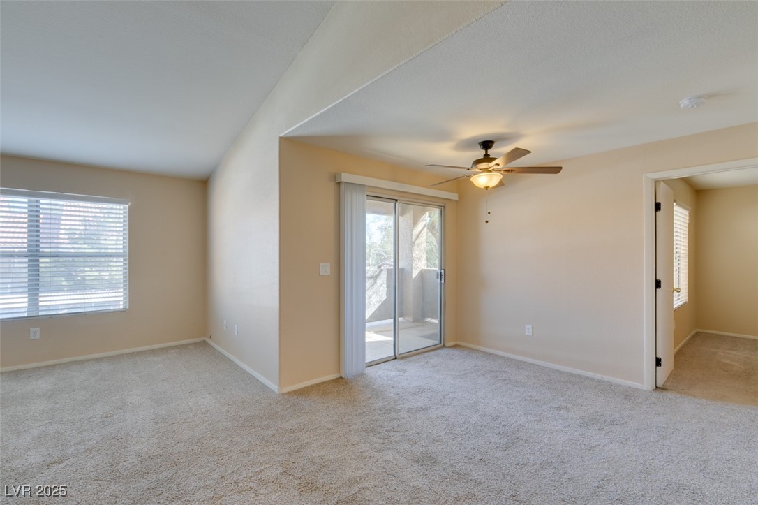 2300 East Silverado Ranch Boulevard, Unit 2190 Las Vegas, NV 89123 - Photo 23 of 41 Spare room with light colored carpet, plenty of natural light, and a ceiling fan