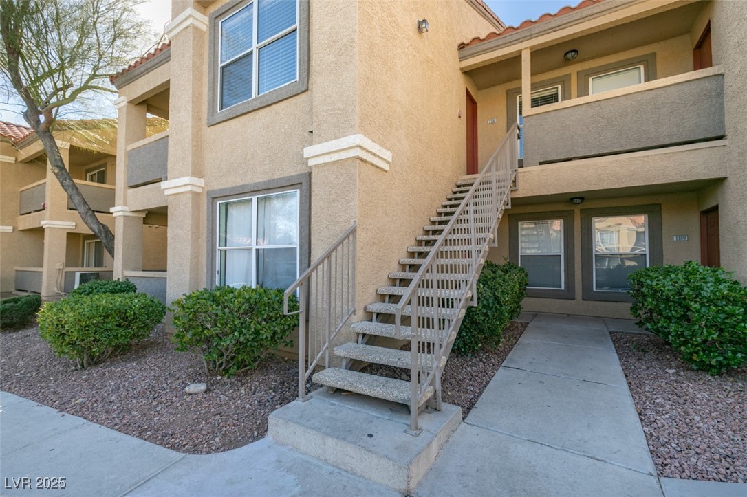2300 East Silverado Ranch Boulevard, Unit 2190 Las Vegas, NV 89123 - Photo 6 of 41 Property entrance with a tile roof and stucco siding