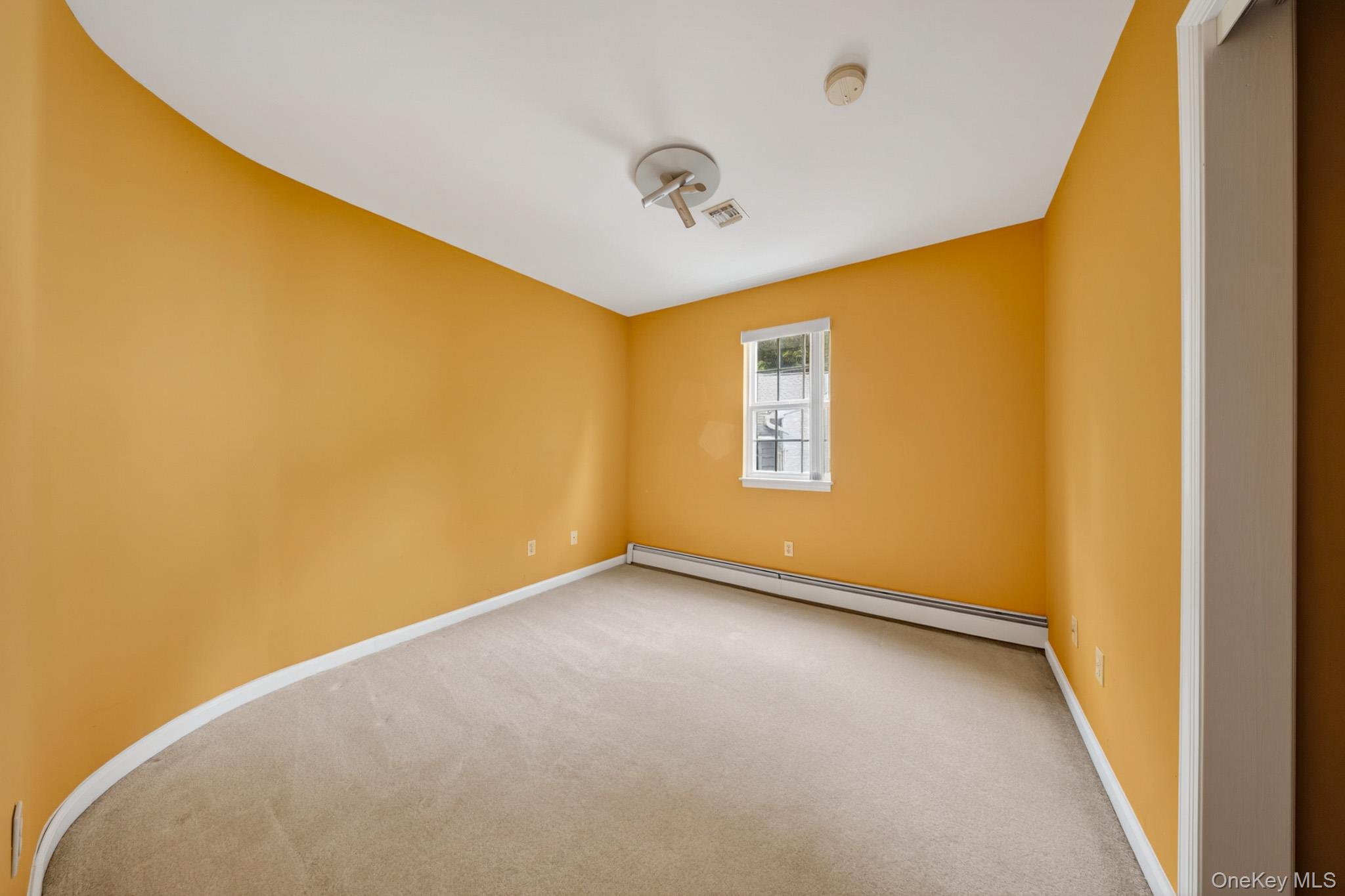 82 B Inwood Road Port Washington, NY 11050 - Photo 25 of 41 a view of a big room with windows and ceiling fan