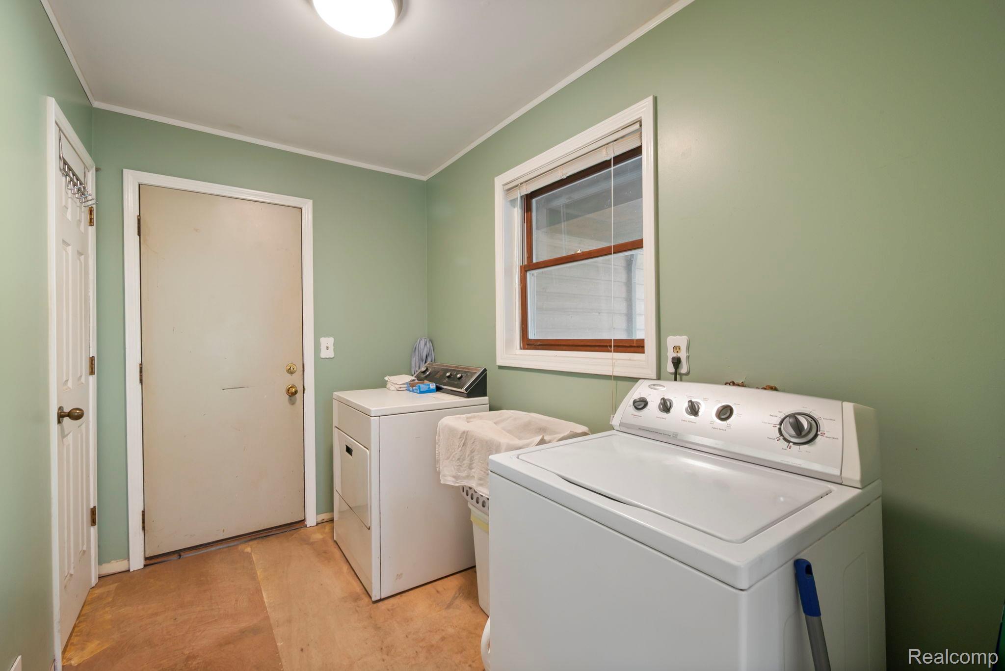76565 McFadden Road Armada, MI 48005 - Photo 42 of 95 Dedicated laundry area featuring a window and overhead lighting