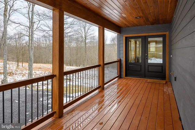a view of wooden balcony with wooden floor