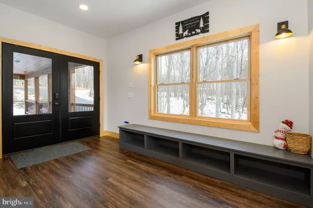 a view of room with window and wooden floor