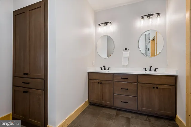 a bedroom with a bed and a night stand