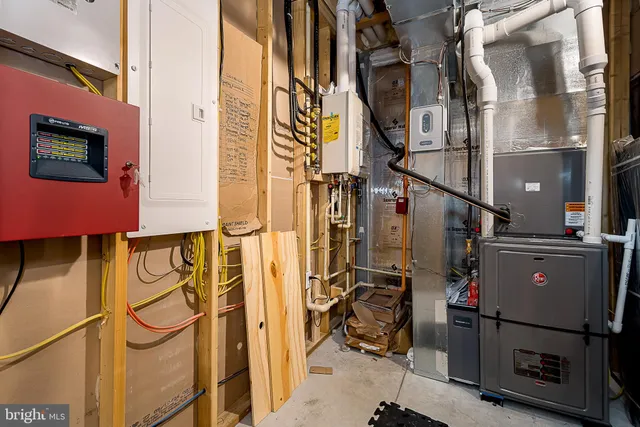 a bathroom with a granite countertop sink mirror vanity and toilet