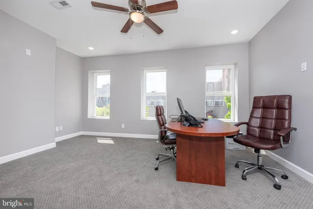 a workspace with furniture and window