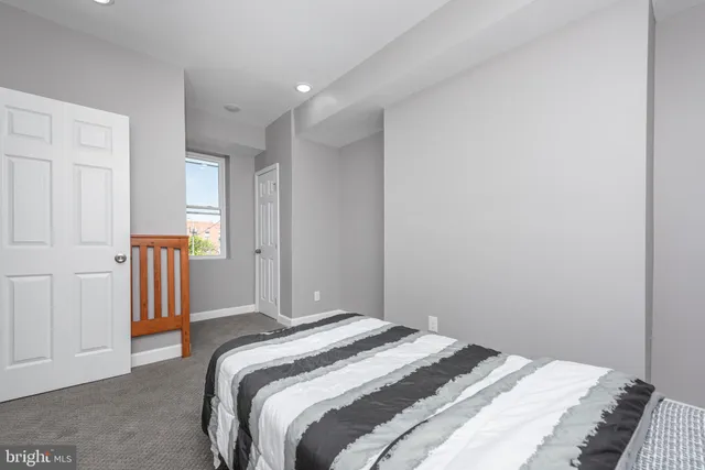 a bedroom with a bed and a closet