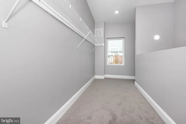 a kitchen with a sink a stove and cabinets