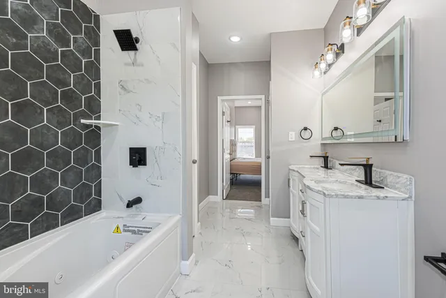 a bathroom with a sink a toilet and a bathtub