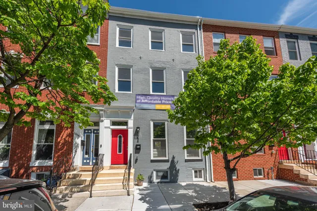 front view of a house with a tree