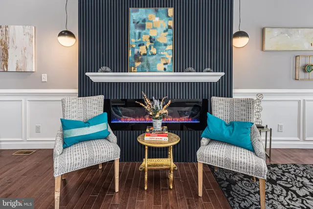 a dining room with furniture and wooden floor