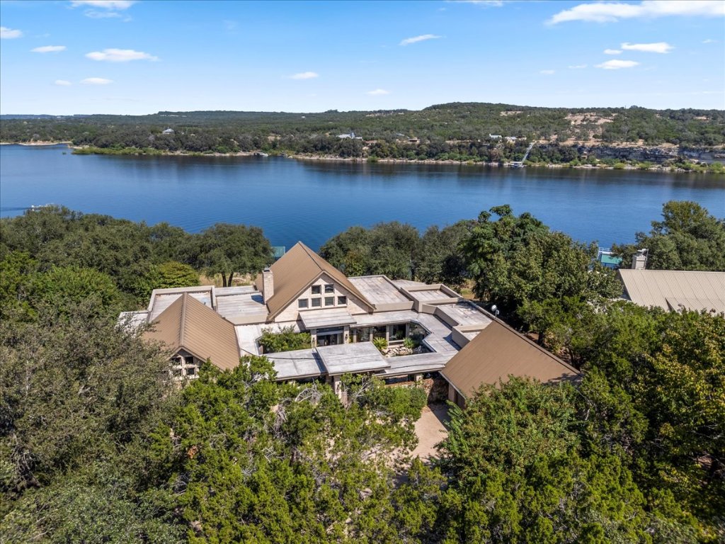 an aerial view of a house with a lake view