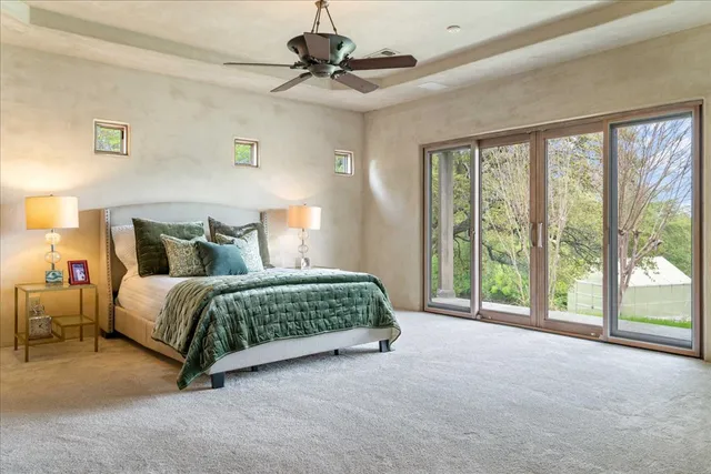 a bedroom with a large bed and a window