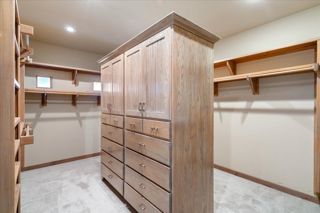 24736 Travis Lakeside Cove, Unit A Spicewood, TX 78669 - Photo 18 of 36 a view of walk in closet