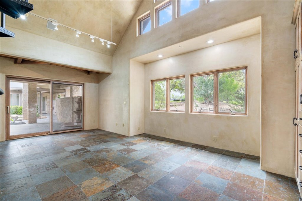 24736 Travis Lakeside Cove, Unit A Spicewood, TX 78669 - Photo 22 of 36 a view of an empty room with a window