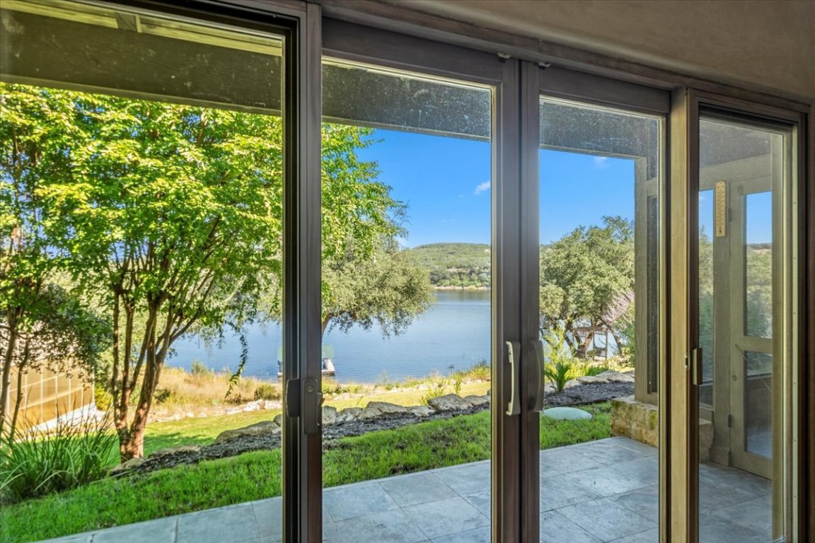 24736 Travis Lakeside Cove, Unit A Spicewood, TX 78669 - Photo 33 of 36 a view of a porch