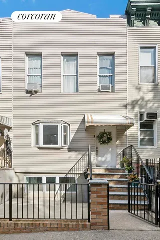 a view of a brick building with many windows