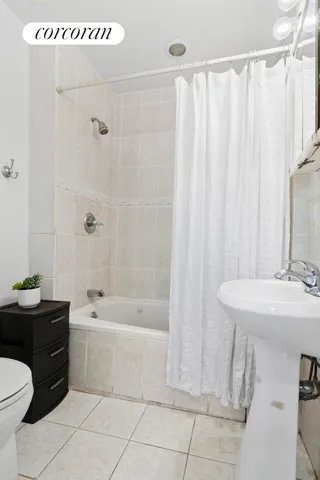 a bathroom with a sink a toilet and a bathtub