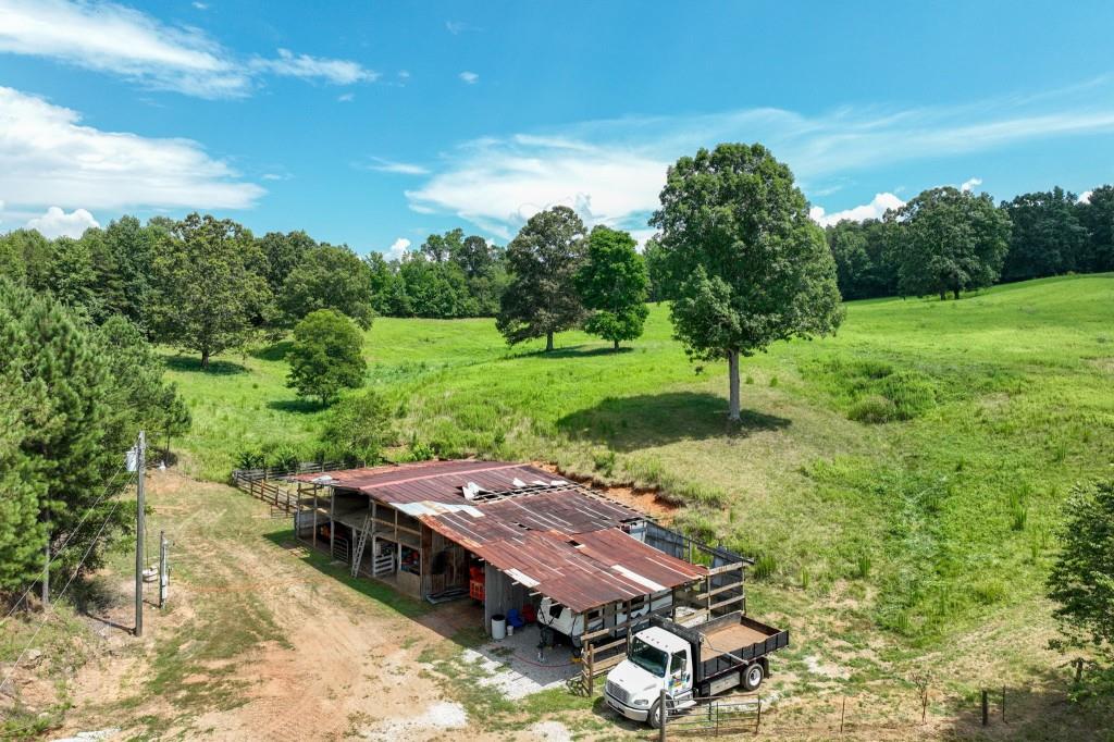 4854 Cagle Mill Road Lula, GA 30554 - Photo 11 of 20 an aerial view of a house with yard and lake view