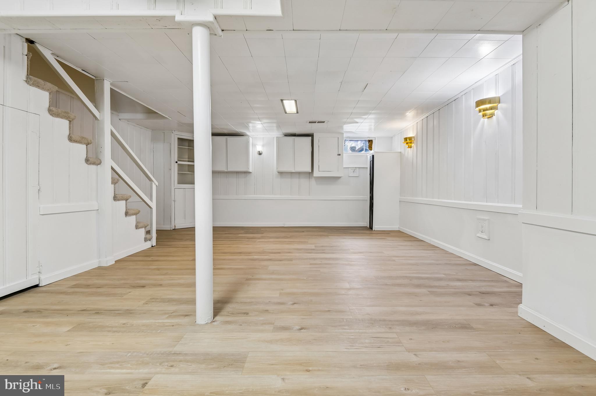 705 Tolna Street Baltimore, MD 21224 - Photo 11 of 34 a view of a hallway view with wooden floor and staircase