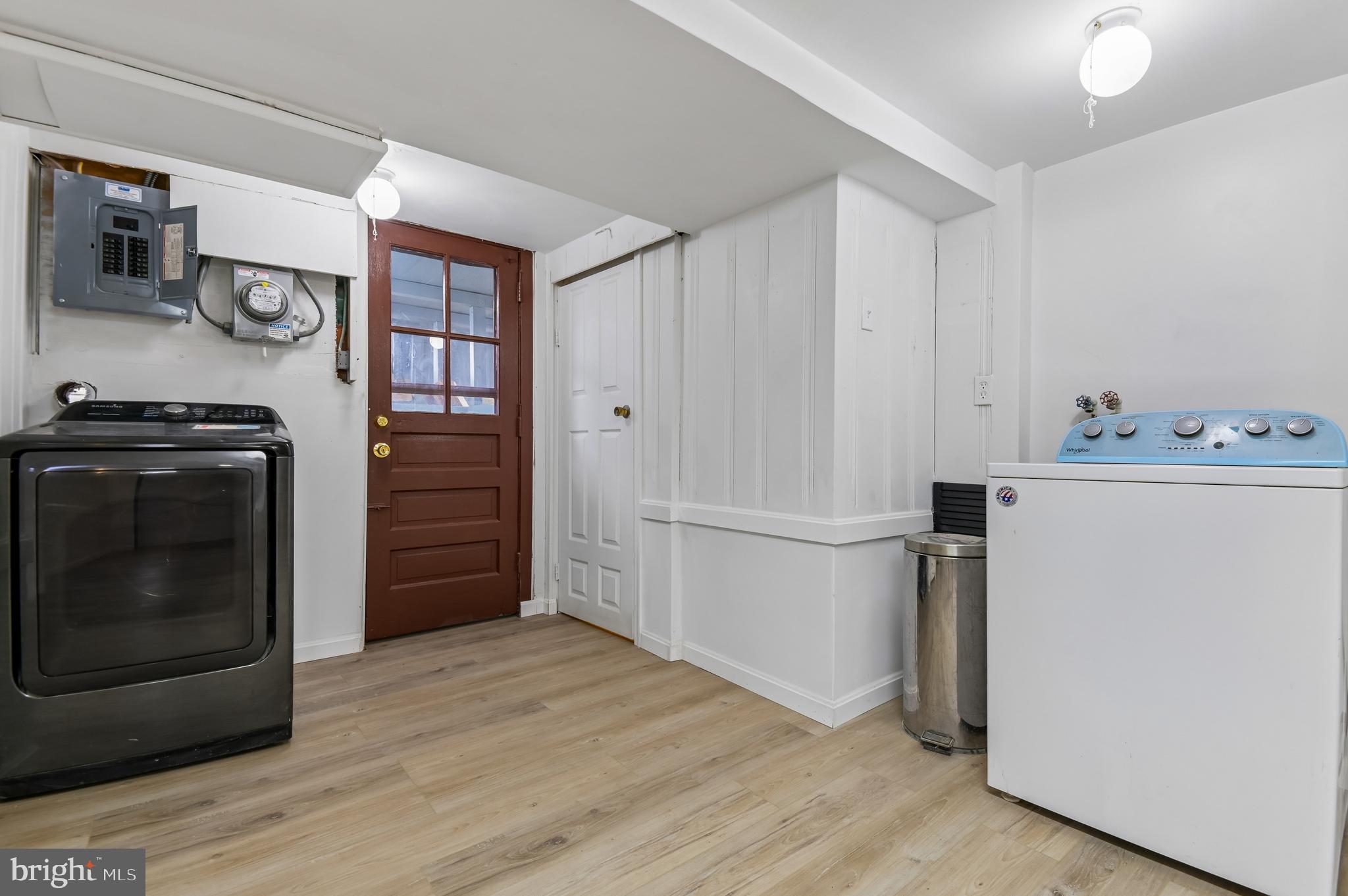 705 Tolna Street Baltimore, MD 21224 - Photo 12 of 34 a kitchen with a stove top oven and refrigerator