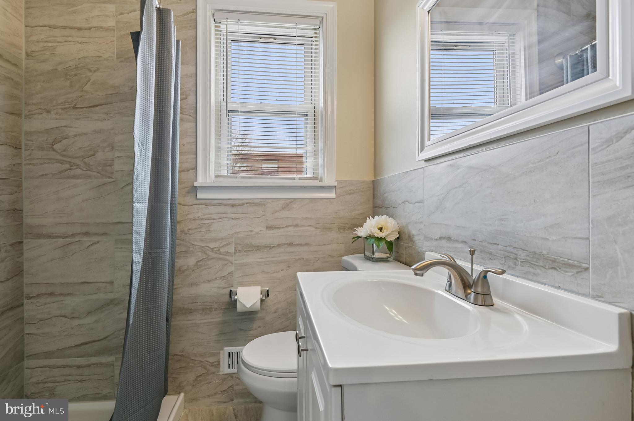 705 Tolna Street Baltimore, MD 21224 - Photo 16 of 34 a bathroom with a sink and a toilet
