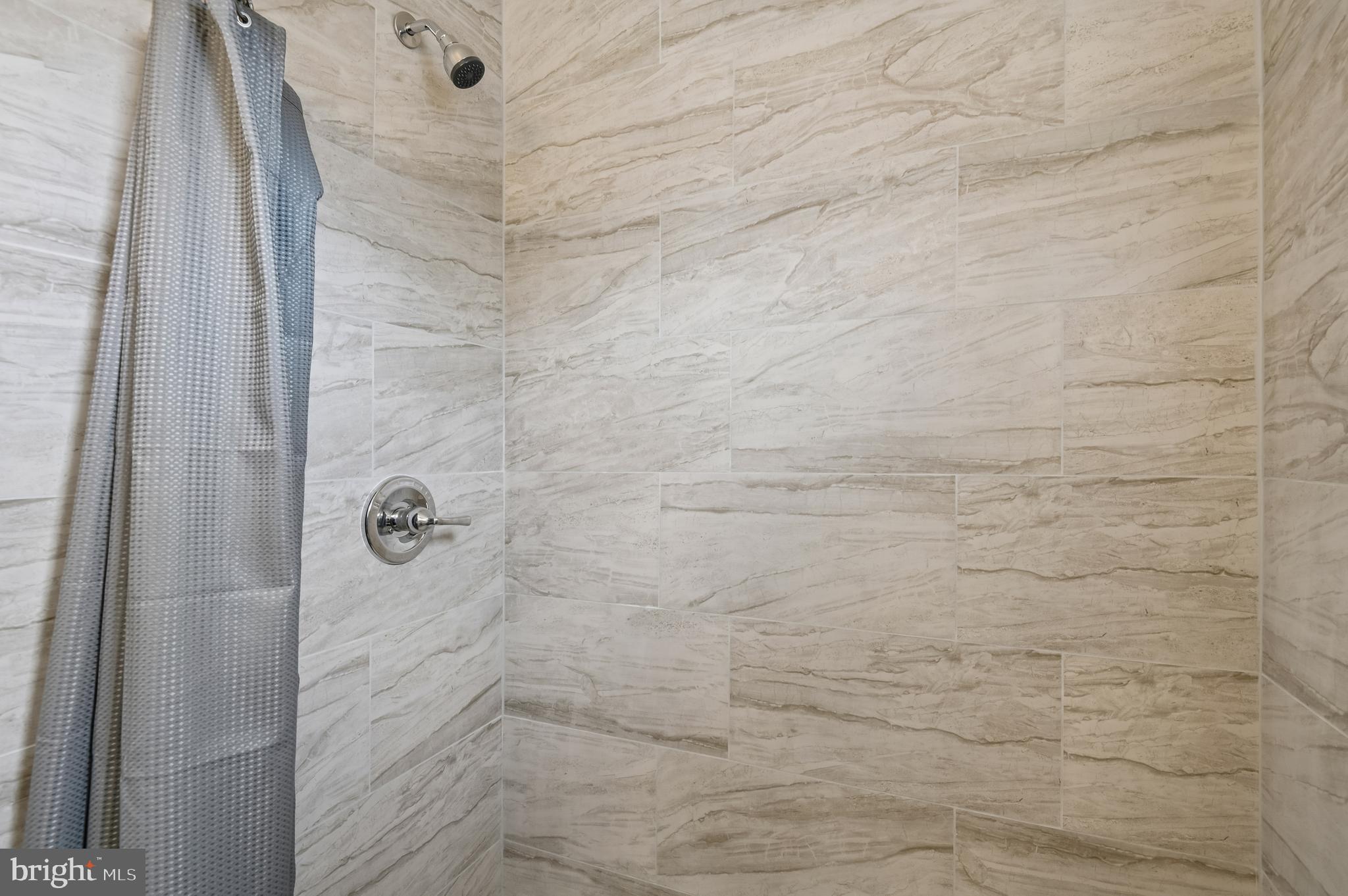 705 Tolna Street Baltimore, MD 21224 - Photo 17 of 34 a bathroom with a shower