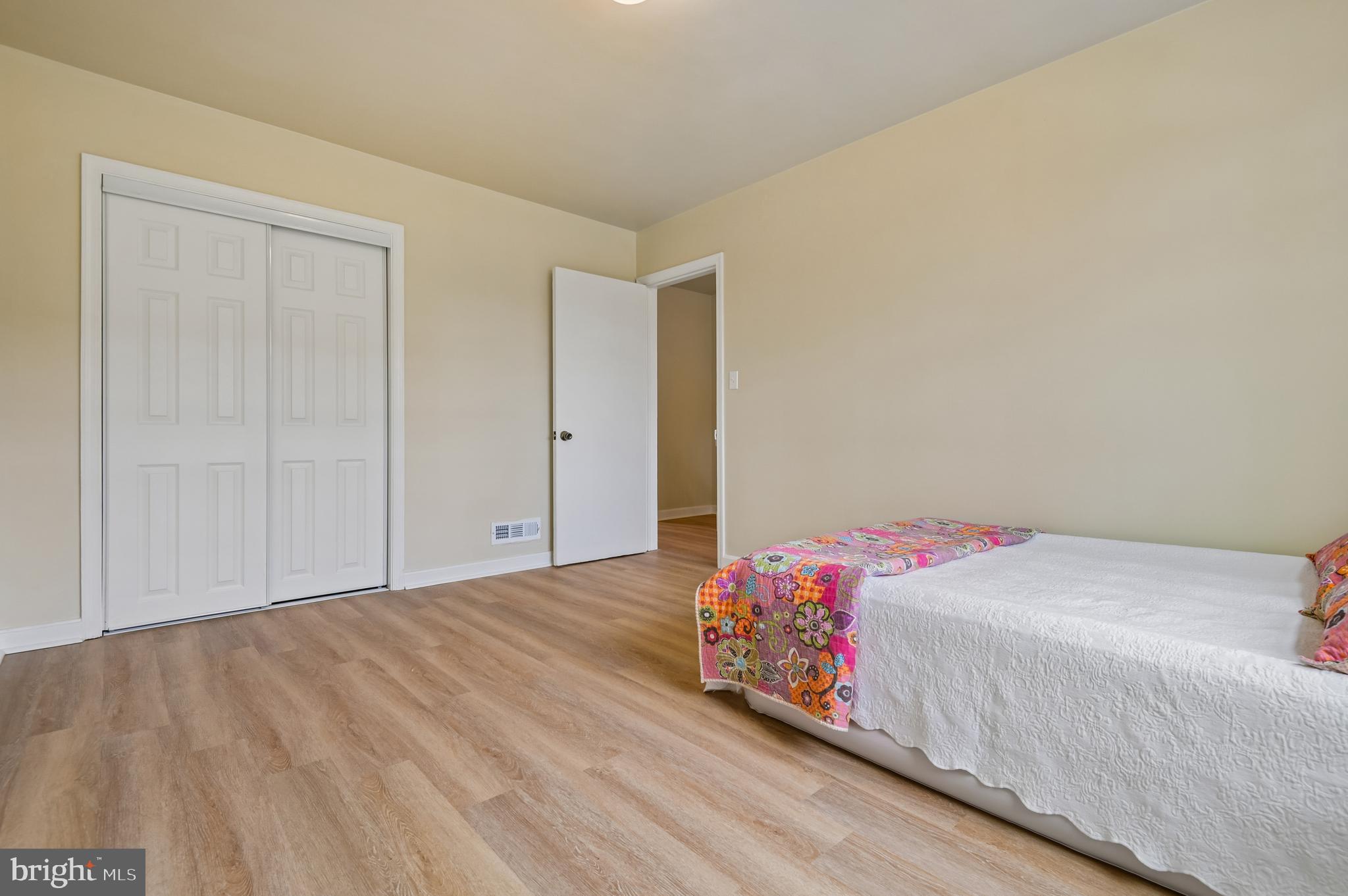 705 Tolna Street Baltimore, MD 21224 - Photo 19 of 34 a bedroom with a bed and a closet