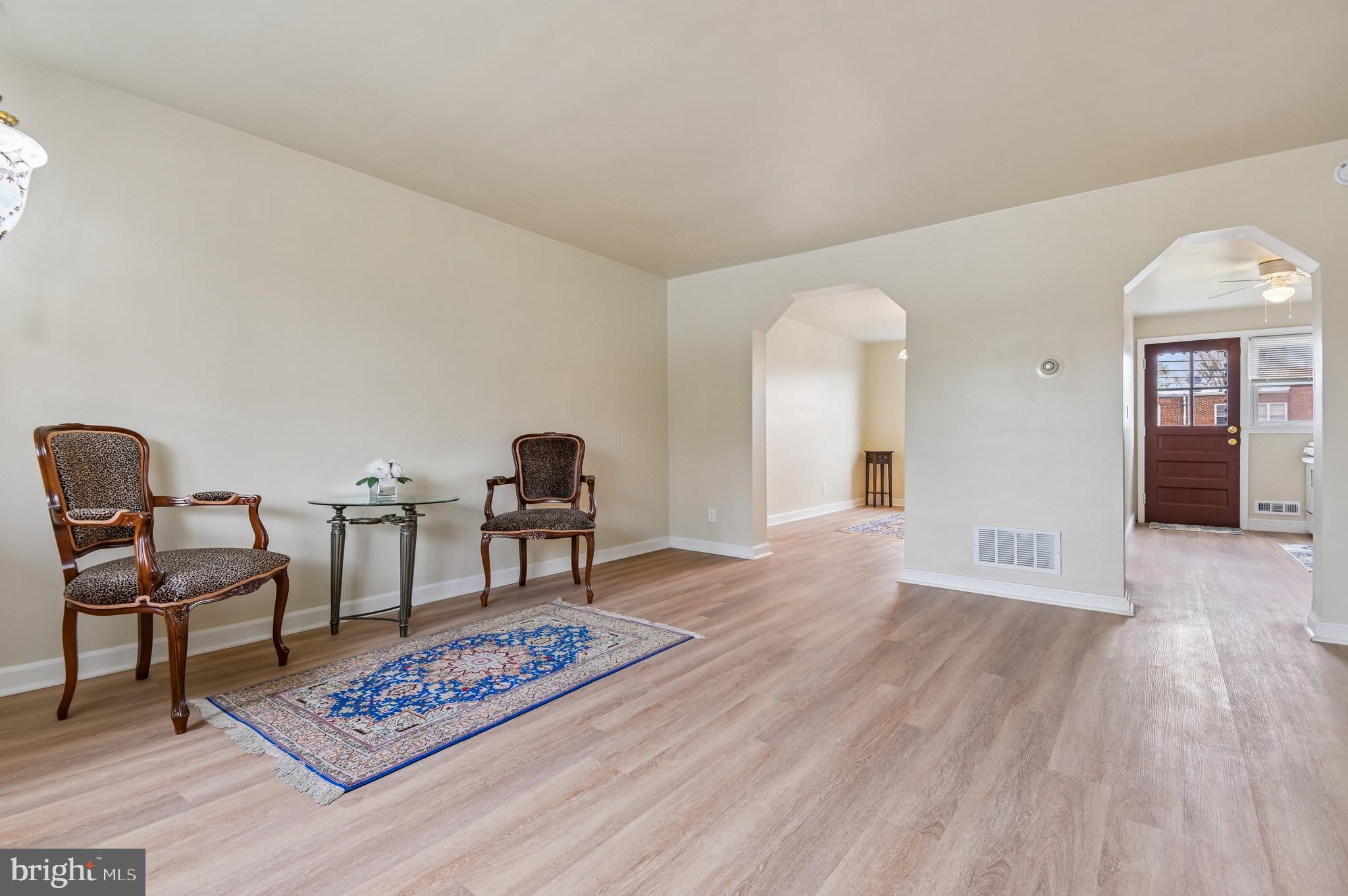 705 Tolna Street Baltimore, MD 21224 - Photo 3 of 34 a view of a livingroom with furniture and wooden floor
