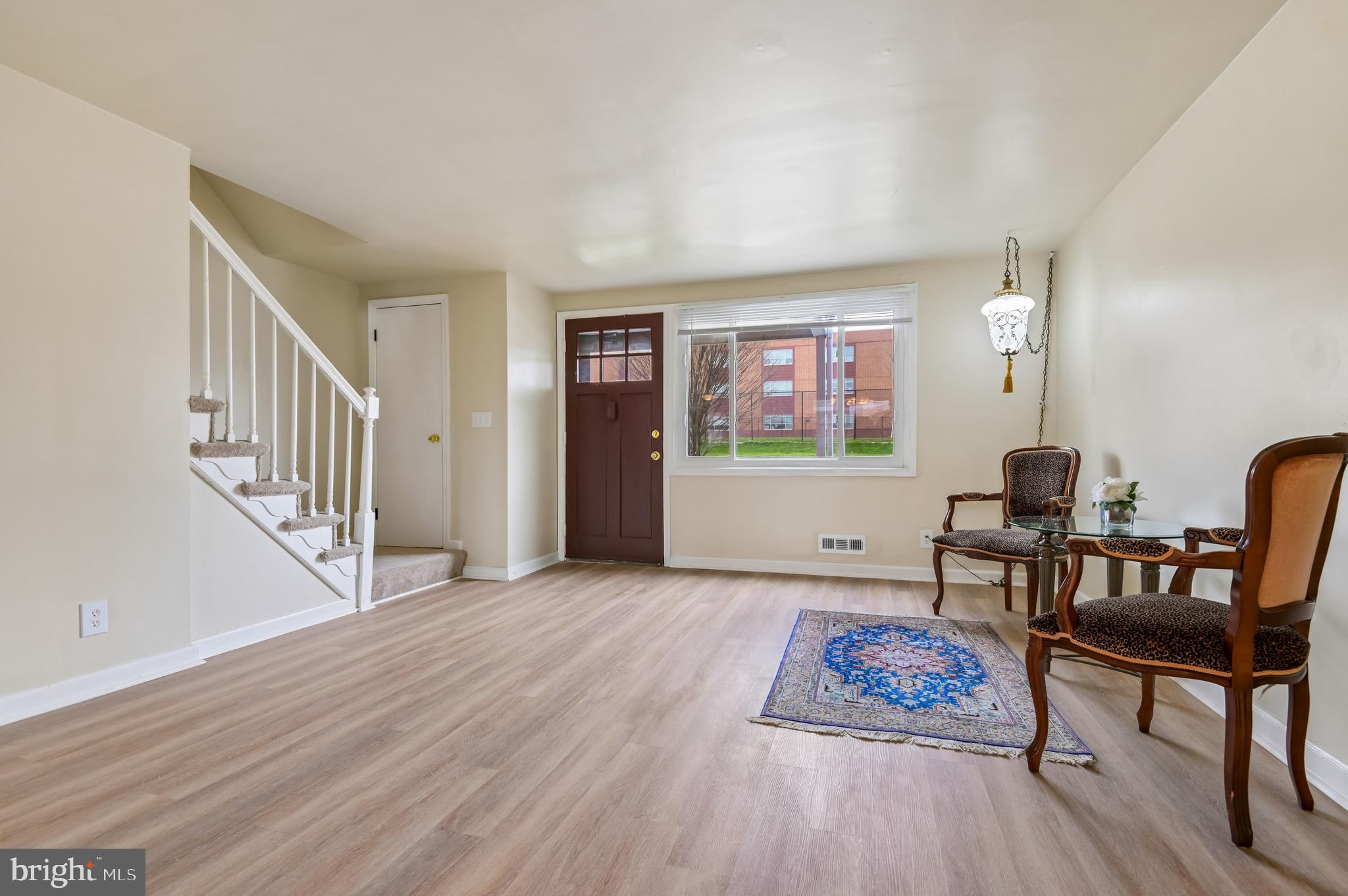 705 Tolna Street Baltimore, MD 21224 - Photo 7 of 34 a living room with furniture and a wooden floor