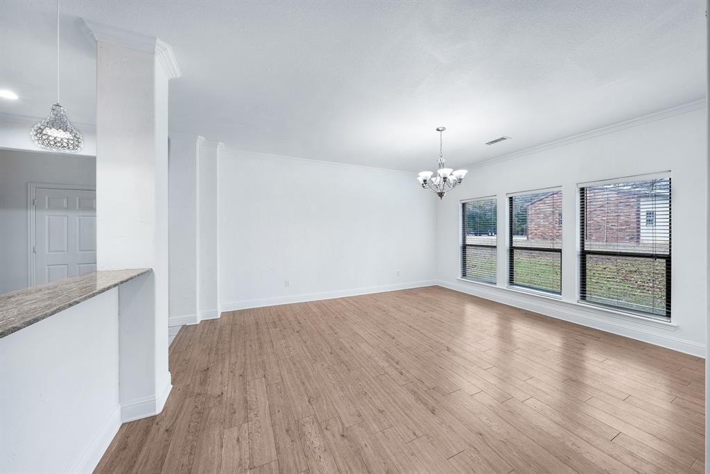 10471 Holly Creek Road Terrell, TX 75160 - Photo 16 of 40 wooden floor in an empty room with a window