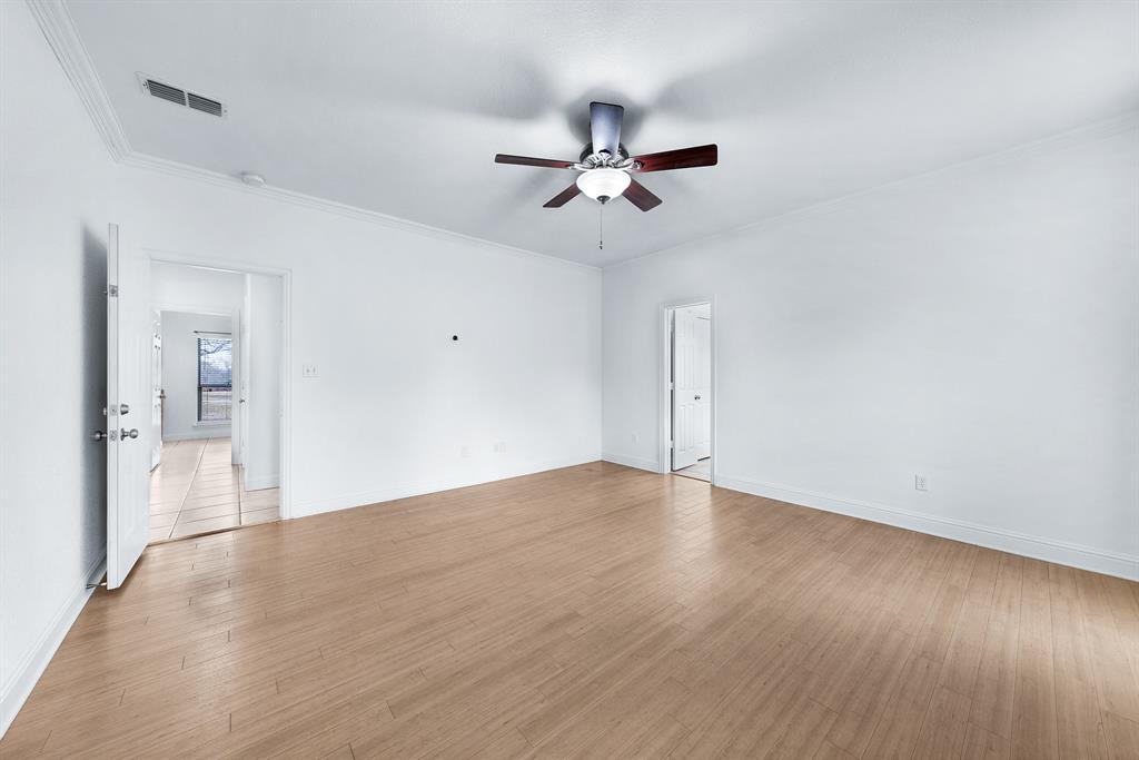 10471 Holly Creek Road Terrell, TX 75160 - Photo 20 of 40 an empty room with wooden floor and windows
