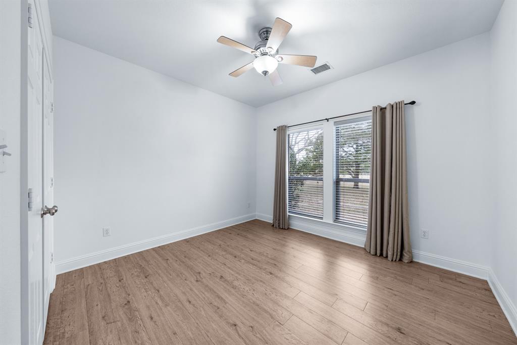 10471 Holly Creek Road Terrell, TX 75160 - Photo 24 of 40 wooden floor in an empty room with a window
