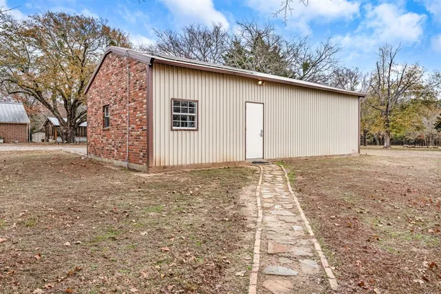 a view of garage yard and tree