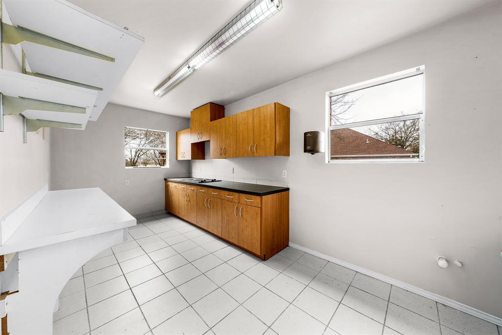 10471 Holly Creek Road Terrell, TX 75160 - Photo 37 of 40 a kitchen with stainless steel appliances granite countertop a sink and cabinets