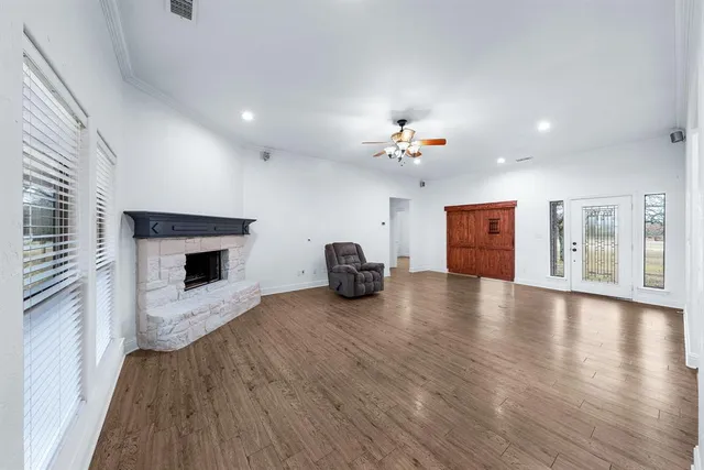 a view of a livingroom with furniture a fireplace
