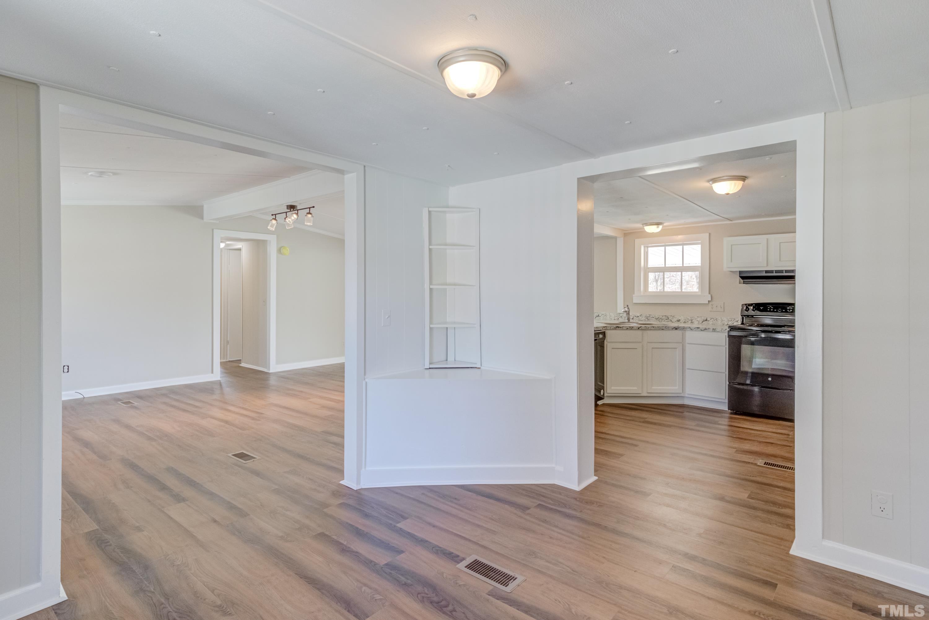 807 Lipscomb Road Angier, NC 27501 - Photo 29 of 39 a view of a kitchen with wooden floor and a sink
