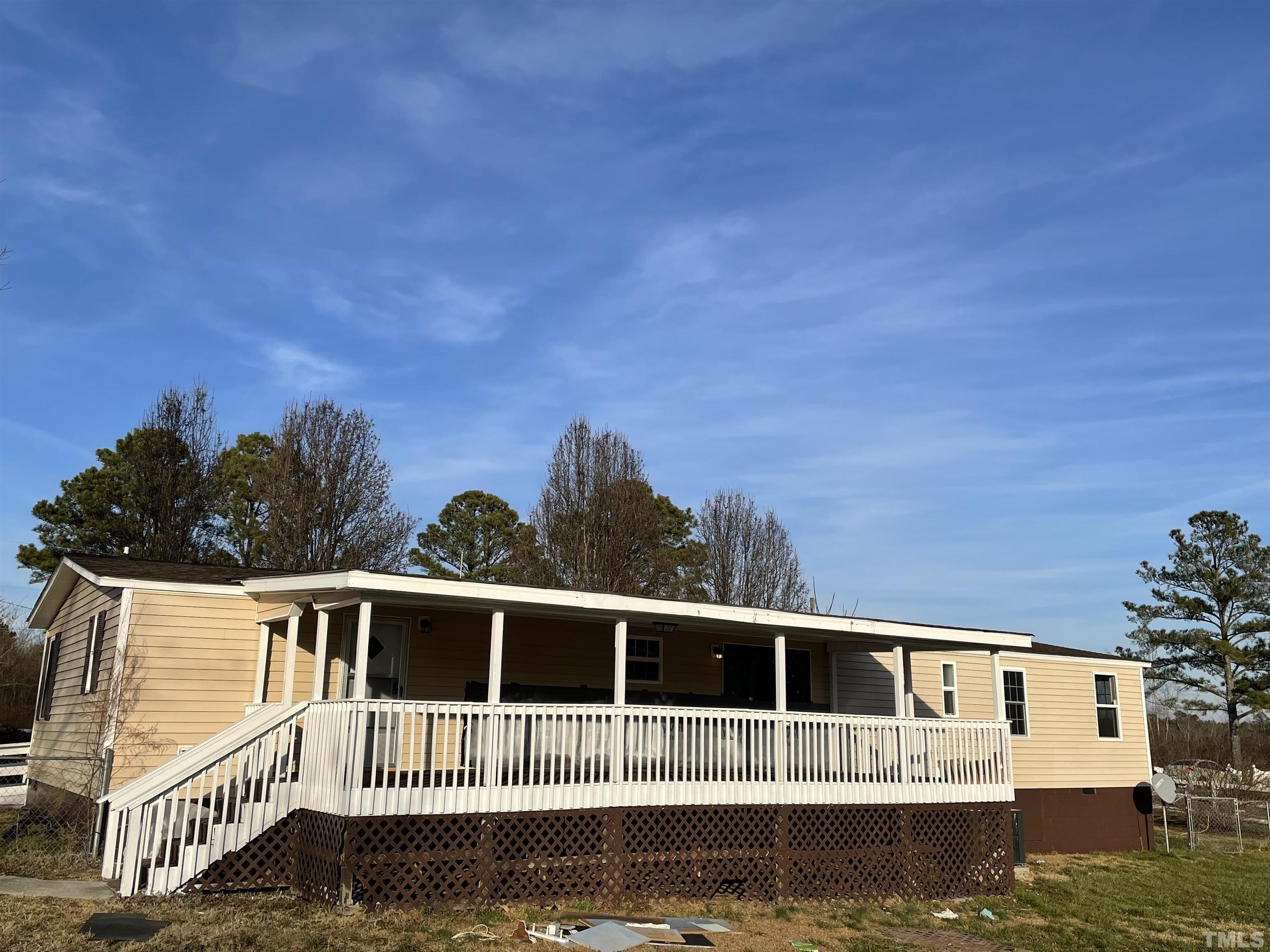 807 Lipscomb Road Angier, NC 27501 - Photo 3 of 39 a front view of a house with a yard